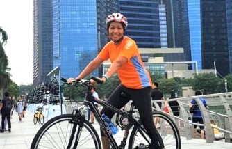 Parent Herald - Determined to give back to society, foreign domestic helper Jannah Pascua runs and cycles to raise funds