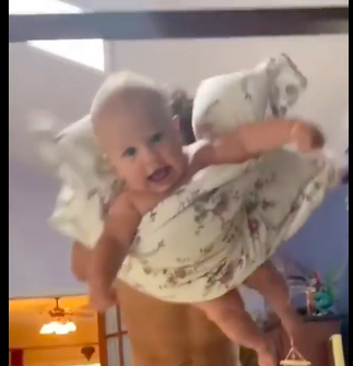 Dad uses a pillow trick to wake up baby