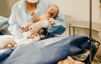Woman gives birth