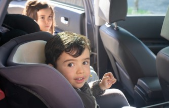 Boy Sitting on Car Seat