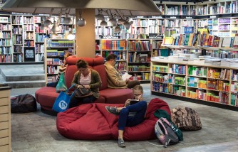 Library Goes Viral With Its Work-Play Stations for Parents and Children: Baby Cribs Attached to Computer Desks 