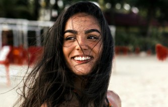 tan girl with beautiful smile